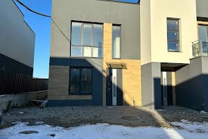 будинок за адресою Коновальця