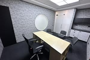 комерційна за адресою Євгена Коновальця вул. (Щорса), 32-Б