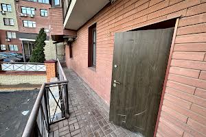 комерційна за адресою Євгена Коновальця вул. (Щорса), 32-Б