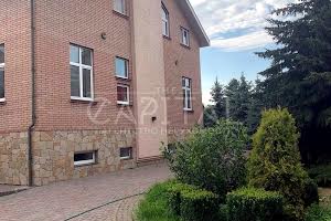 будинок за адресою смт. Козин, Олександрівська вул.