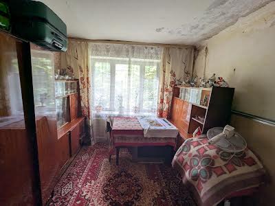 комната по адресу Строителей ул., 12