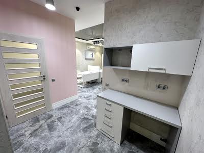 комерційна за адресою Євгена Коновальця вул. (Щорса), 32-Б